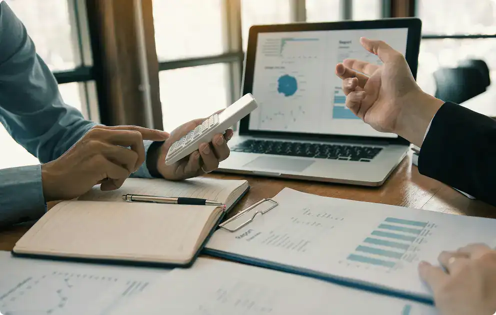 Calculating and analysing financial data for business growth at Hayes FP office.